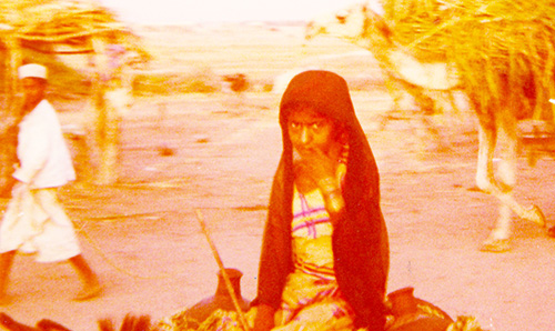 Curious young girl in a sleepy Yemeni village
